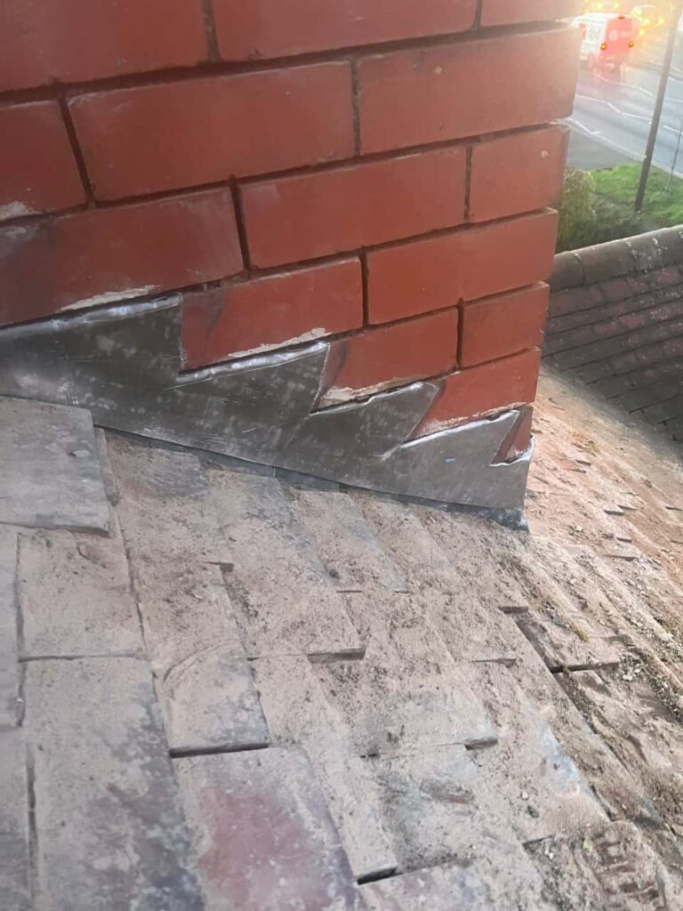 This is a photo of new leadwork being installed around an old chimney. Works carried out by TRP Roofing Hessle